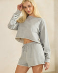 Model wearing BTTRMMT gray cropped sweatshirt and matching Sweet Easy Flow Shorts, showcasing a soft, casual lounge set