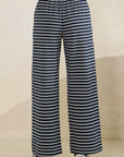 Back view of BTTRMMT Ellie Striped Pants in navy and white, showing relaxed wide-leg fit and elastic waistband.