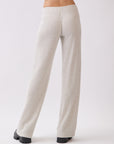 Back view of BTTRMMT Rae Wide Rib Pant in light beige, featuring ribbed texture and wide-leg silhouette.