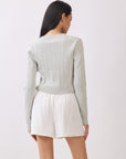 BTTRMMT Joelle Scallop Trim Cardigan back view highlighting fitted silhouette and ribbed knit texture