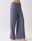 Side view of BTTRMMT Denim Calia Pants featuring a relaxed wide-leg fit and drawstring waistband.