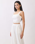 Close-up view of BTTRMMT Ivory Olivyn Set showing cropped square-neck top with wide straps and textured fabric detail.