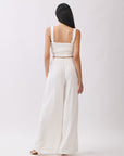 Back view of BTTRMMT Ivory Olivyn Set showing square-back cropped top with wide straps and matching flowy wide-leg pants.