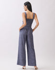 Back view of BTTRMMT The Delilah Set, blue textured two-piece showing square-back crop top and wide-leg pants.