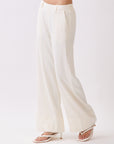 Side view of BTTRMMT Ivory Sophia Pants featuring a high-waist tailored fit, front seam detail, and wide-leg silhouette