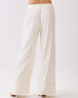 Back view of BTTRMMT Ivory Sophia Pants showing the high-waist tailored fit, clean back panel, and wide-leg drape.