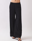 BTTRMMT Black Sophia Pants close-up showing the mid-rise waistband, front seam detailing, and soft wide-leg drape.