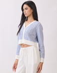 BTTRMMT Jordyn Contrast Knit Cardigan side view showing long sleeves, cropped length, and contrast cuffs