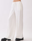 Side view of BTTRMMT Ivory Calia Pants featuring a relaxed wide-leg fit and soft draped silhouette.