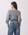 Back view of Model wearing BTTRMMT Gray Tessa Boatneck Sweater, ribbed off-shoulder knit with long sleeves.