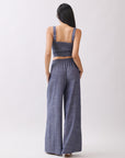 Back view of BTTRMMT Denim Olivyn Set in blue, showing the cropped top and high-waist wide-leg pants in a relaxed denim silhouette.