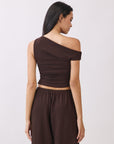 Back view of model wearing the BTTRMMT Daniela Off-Duty Set in brown featuring a fitted ruched back and matching wide-leg pants.