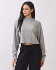 Model wearing the BTTRMMT Elina High Neck Sweater in heather gray, a soft cropped knit with long sleeves and a relaxed fit.