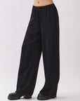 BTTRMMT Black Calia Pants side view highlighting flowy silhouette and comfortable waistband