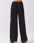 BTTRMMT Black Calia Pants back view showing clean lines and easy pull-on fit