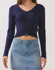 Close-up of BTTRMMT Alina Vneck Sweater in navy, ribbed knit texture with flattering V-neckline detail.
