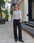 Model wearing the heather gray Elina High Neck Sweater with a cropped fit, long sleeves, and soft high neckline.