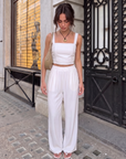 Model wearing BTTRMMT Ivory Olivyn Set featuring a cropped square-neck top and matching high-waisted wide-leg pants.