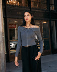 BTTRMMT Camille Zip Knit close-up, charcoal off-shoulder ribbed sweater with fitted cropped design.