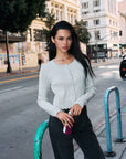 BTTRMMT L Joelle Scallop Trim Cardigan front view worn in downtown Los Angeles with scalloped neckline and button front