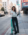 BTTRMMT L Joelle Scallop Trim Cardigan front view worn in downtown Los Angeles with scalloped neckline and button front