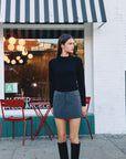 BTTRMMT Leia Skort styled on model in downtown Los Angeles street in front of coffee shop.