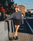 BTTRMMT Ellie Striped Long Sleeve front view worn outdoors in Los Angeles, navy and white stripes with red neckline