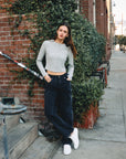 BTTRMMT Evie Mid-rise Washed Black Denim Jeans with relaxed straight-leg fit styled casually outdoors