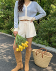 BTTRMMT Jordyn Contrast Knit Cardigan front view with cropped fit, V-neckline, contrast trim, and textured blue knit