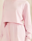 BTTRMMT Pink Sweet Easy Sweatshirt close-up showing soft texture, cropped hem, and comfortable long sleeves