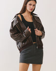 BTTRMMT Reign Faux Leather Jacket front view with oversized fit, zip front, and smooth faux leather