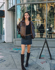 BTTRMMT Reign Faux Leather Jacket styled on model in downtown Los Angeles street