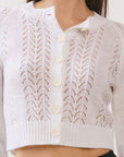 BTTRMMT lila lace cardigan close-up showing lace pattern, button detail, and soft knit fabric