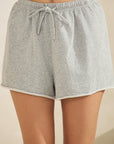 Close up view of BTTRMMT Gray Sweet Easy Flow Shorts featuring a relaxed fit, soft heather fabric, and drawstring waist.