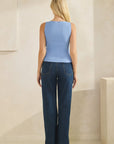 Back view of model wearing the BTTRMMT Blue Serenity Top, showing smooth ribbed design and clean fitted silhouette paired with denim.