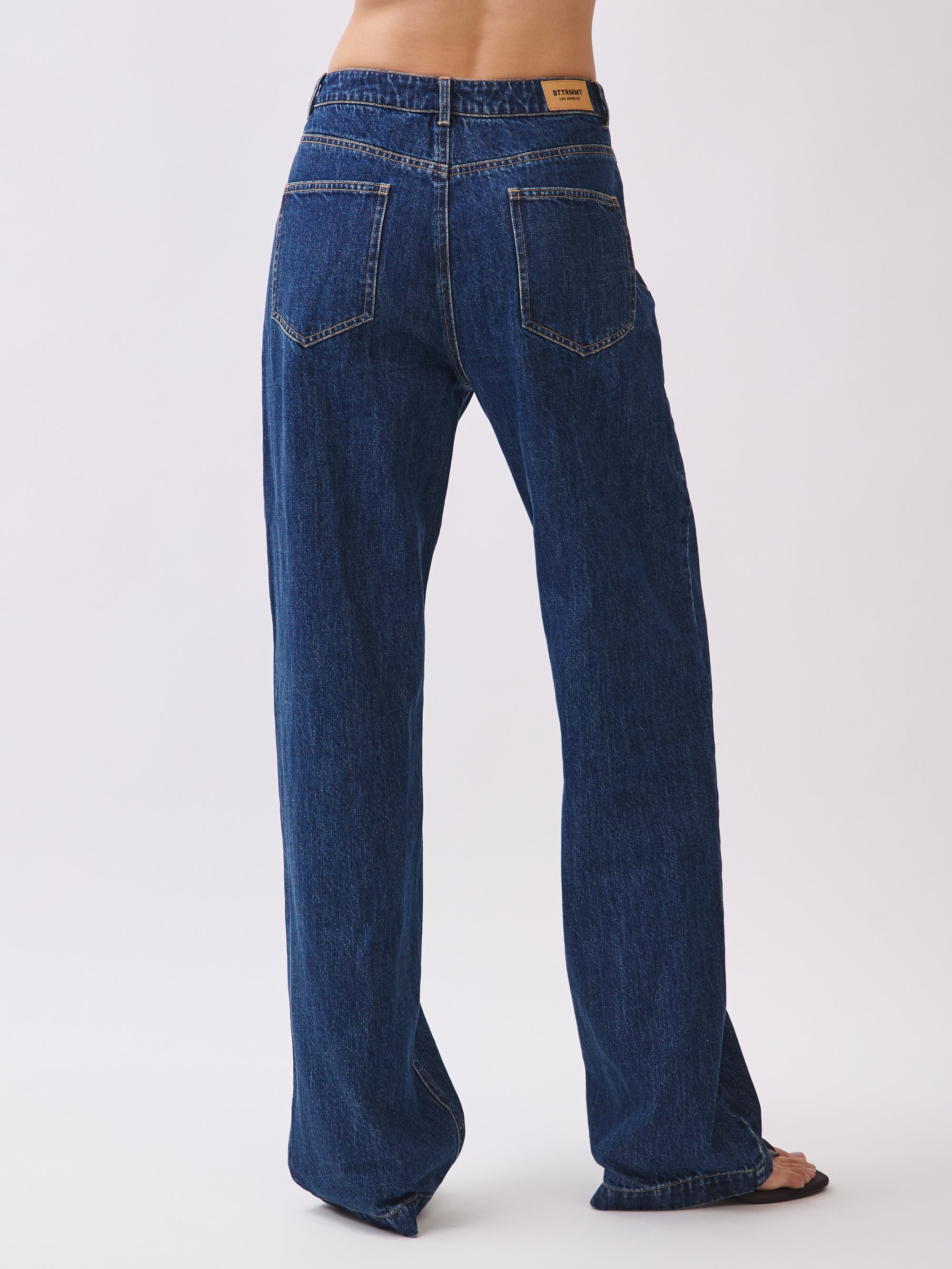 Back view of BTTRMMT Emery Straight Jean in dark blue denim, featuring a mid-rise waist and classic straight-leg silhouette.