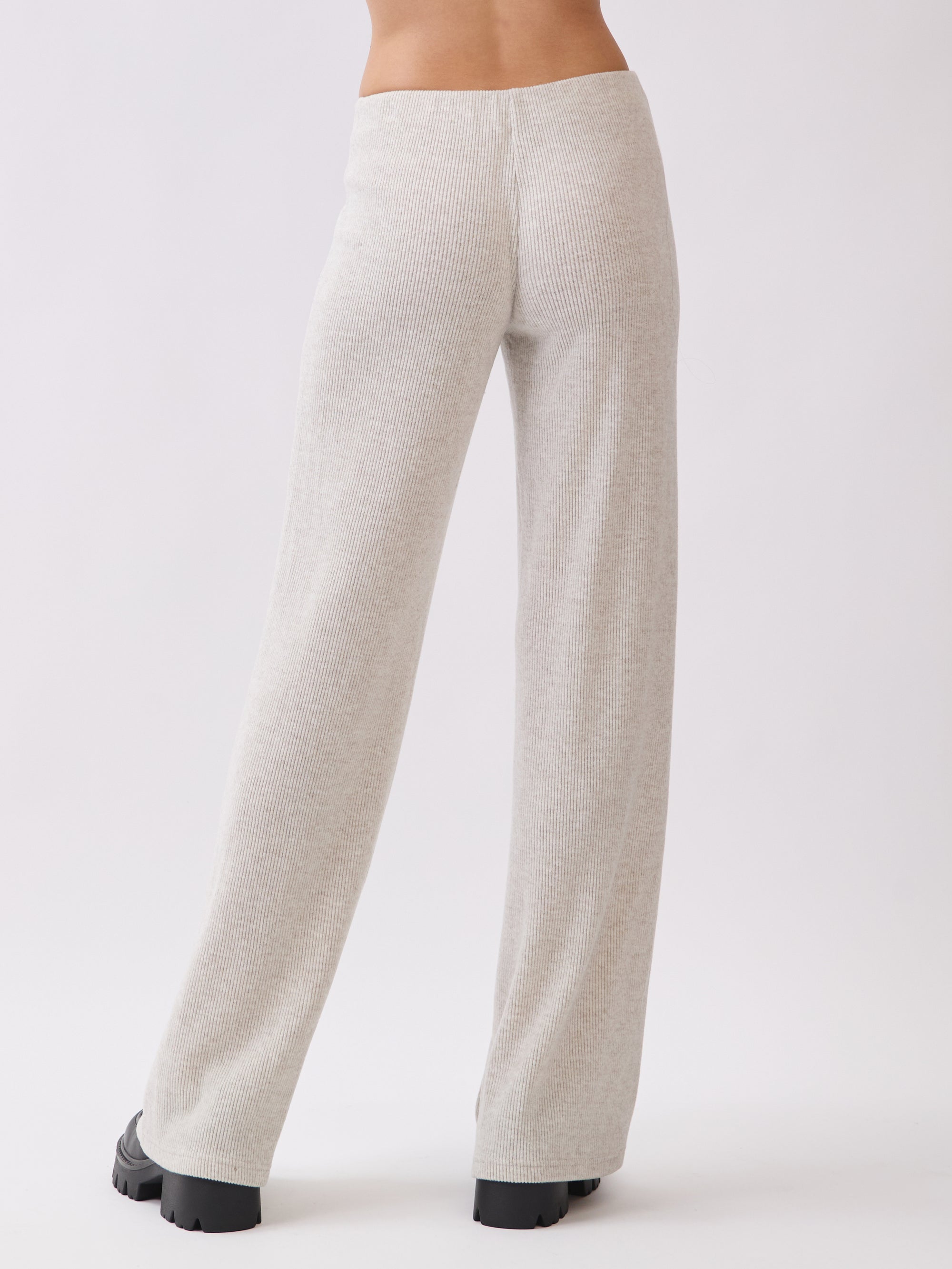 Back view of BTTRMMT Rae Wide Rib Pant in light beige, featuring ribbed texture and wide-leg silhouette.