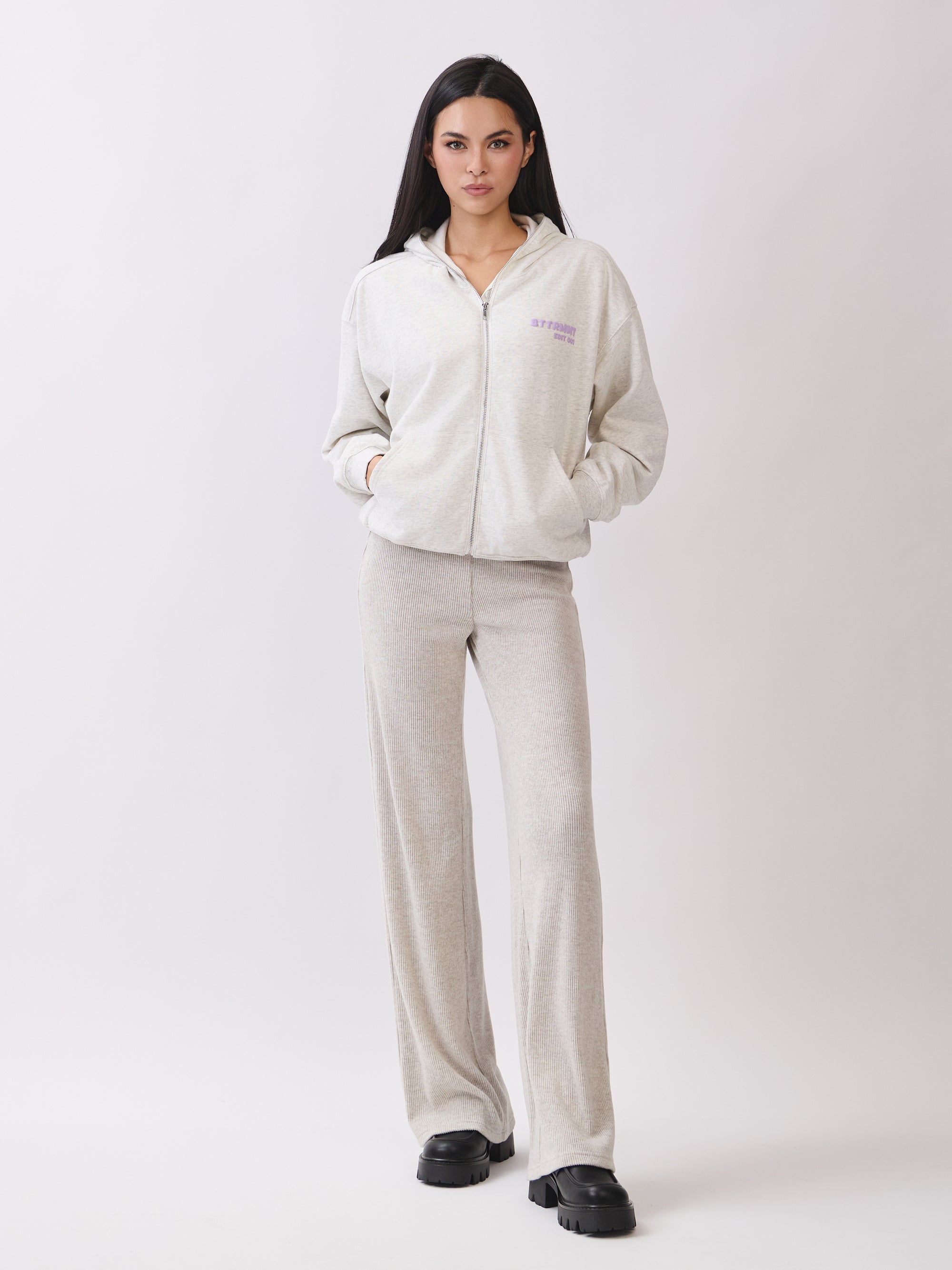 BTTRMMT Chill Zip Hoodie and matching shorts styled over a black tank, creating a relaxed, neutral loungewear look