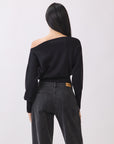 Back view of BTTRMMT Black Tessa Boatneck Sweater, relaxed off-shoulder knit with ribbed waist.