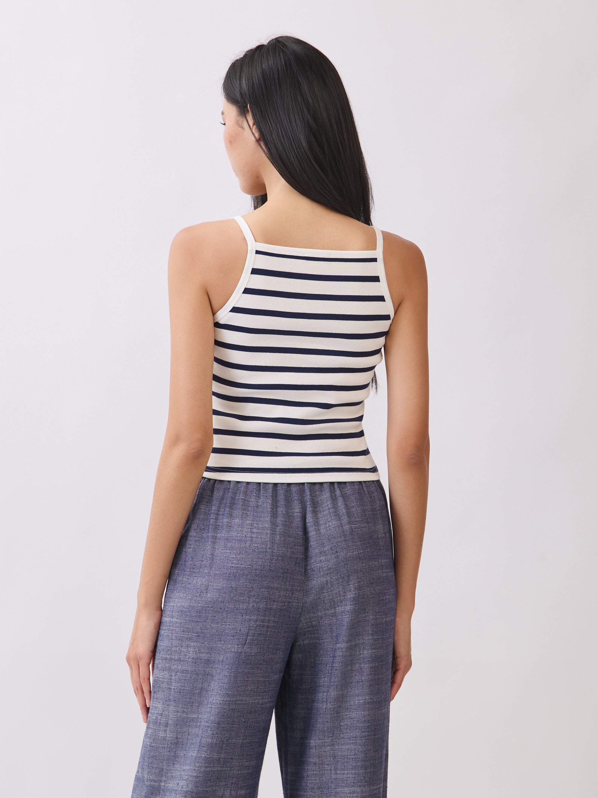 Back view of BTTRMMT Ivory and Navy Striped Ribbed Tank Top showing slim straps, ribbed texture, and cropped fit