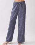 Model wearing BTTRMMT Denim Calia Pants with a soft feel, wide-leg silhouette, and adjustable drawstring waist.