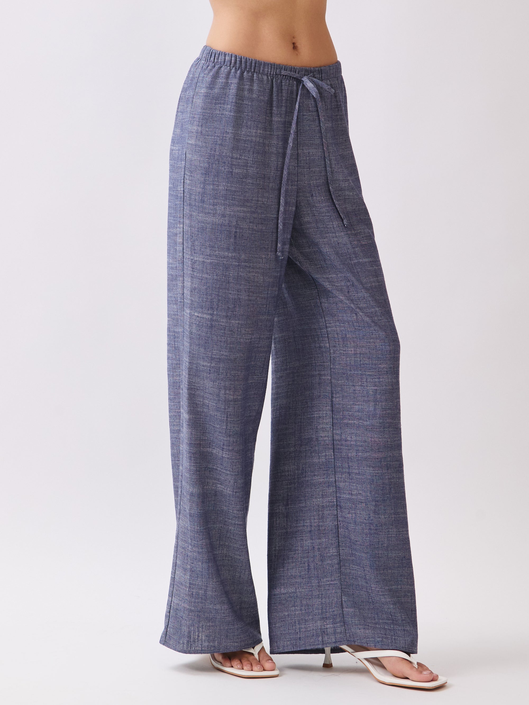 Side view of BTTRMMT Denim Calia Pants featuring a relaxed wide-leg fit and drawstring waistband.