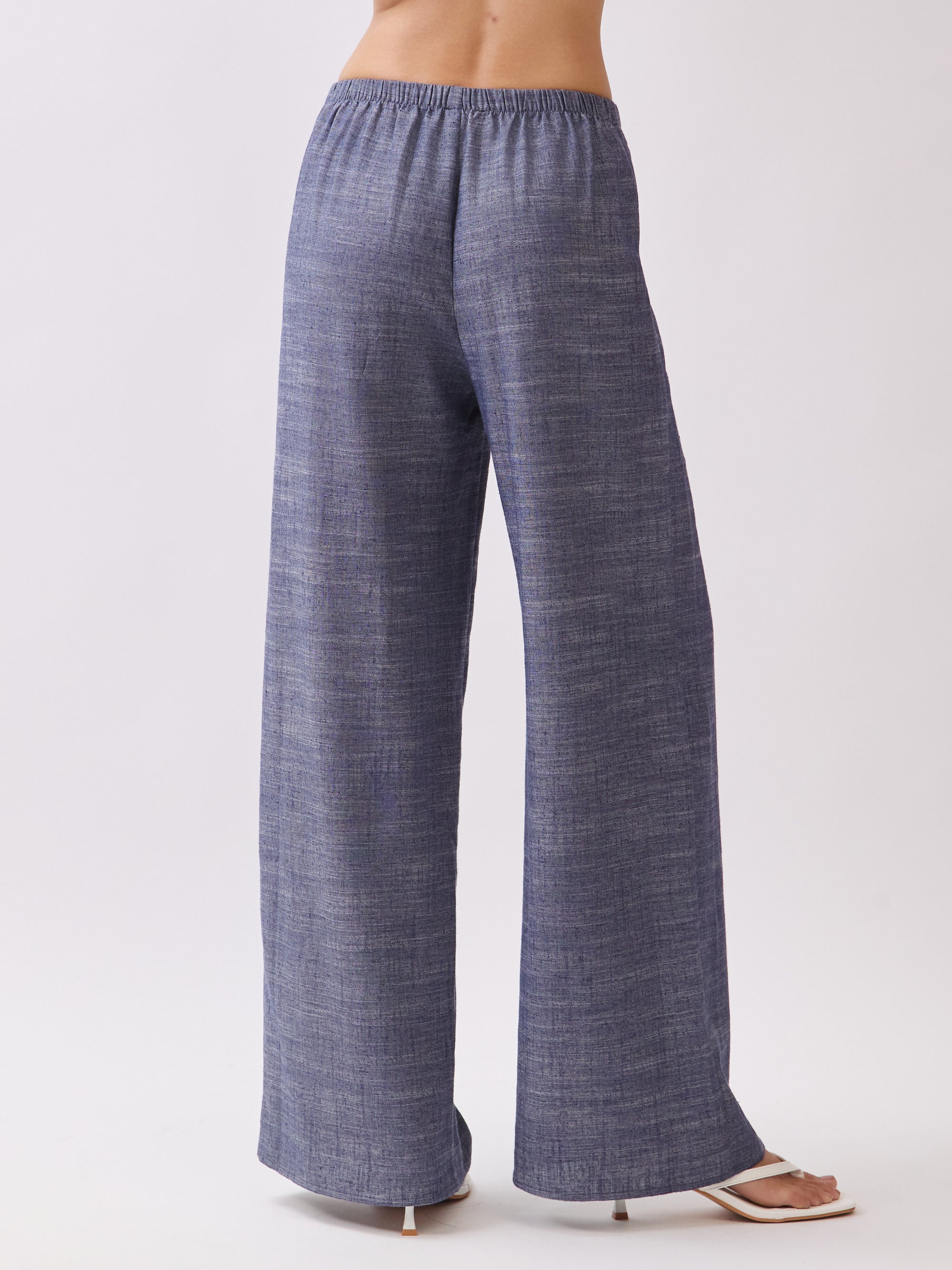 Back view of BTTRMMT Denim Calia Pants showcasing the relaxed wide-leg silhouette and comfy elastic waistband.