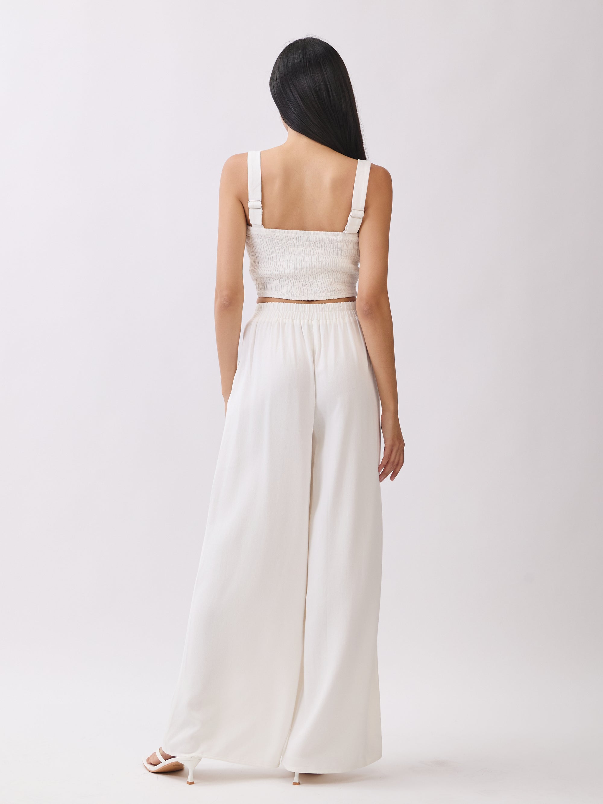 Back view of BTTRMMT Ivory Olivyn Set showing square-back cropped top with wide straps and matching flowy wide-leg pants.