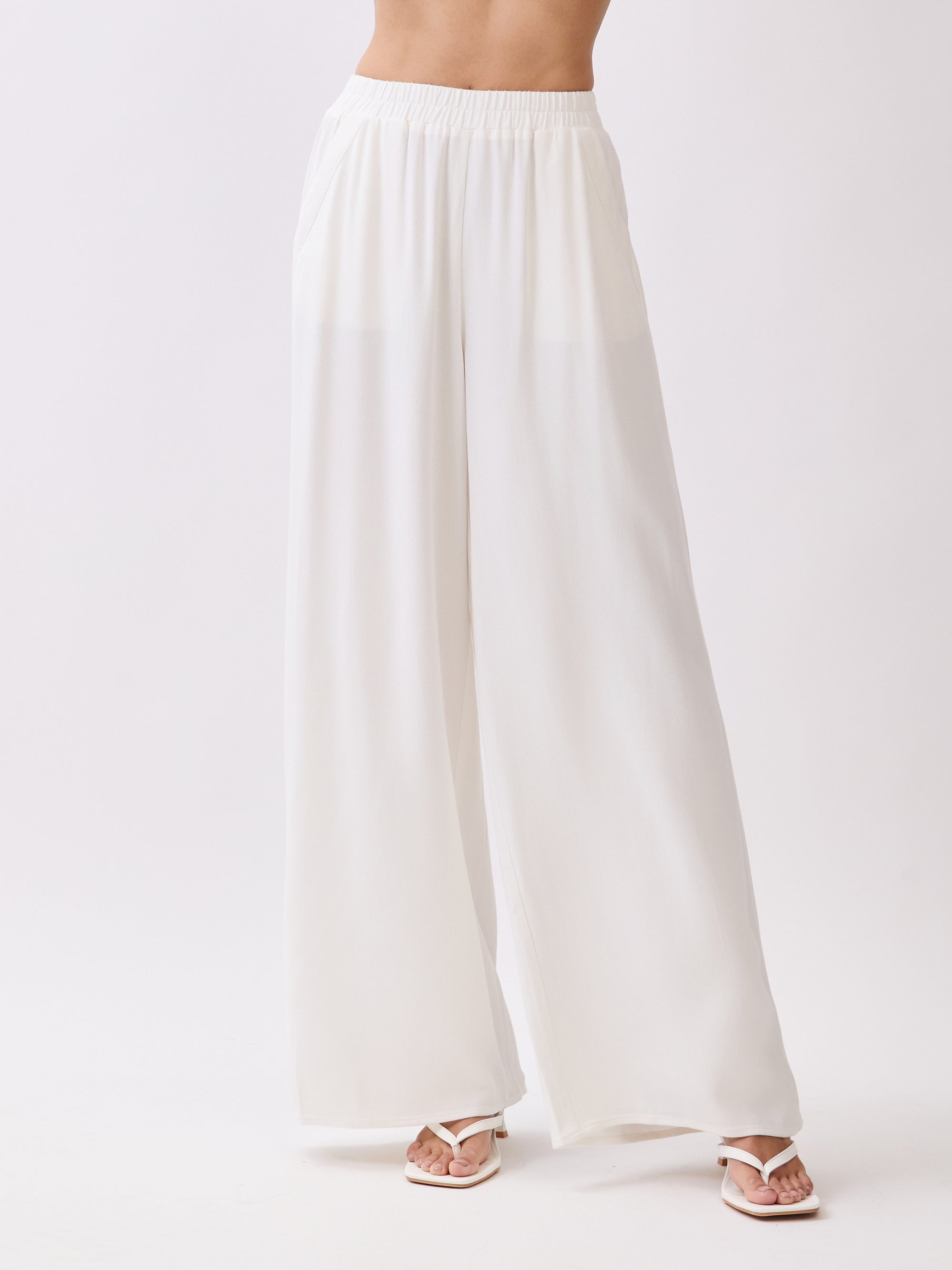 Close-up of BTTRMMT Ivory Olivyn Set pants showing lightweight wide-leg design with elastic waistband and side pockets.