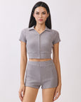 BTTRMMT Lia Ripped Zip Up Top front view with cropped fit, short sleeves, and front zip detail