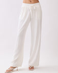 Front view of BTTRMMT Ivory Yuna Soft Wide Leg Pants featuring an elastic waistband, drawstring tie, and flowy lightweight fabric.