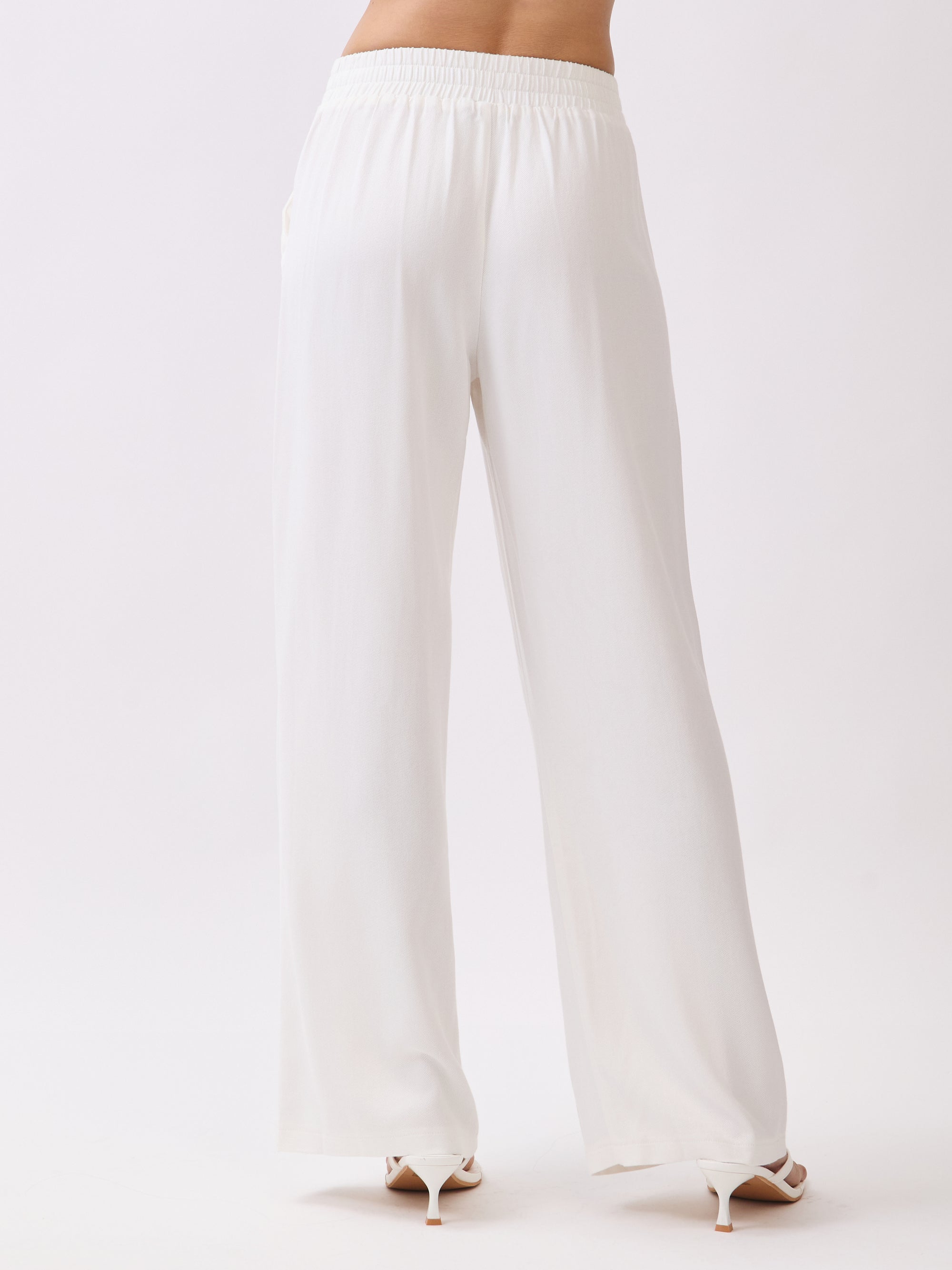 Back view of BTTRMMT Ivory Yuna Soft Wide Leg Pants showcasing the elastic waistband, smooth back, and wide-leg silhouette.