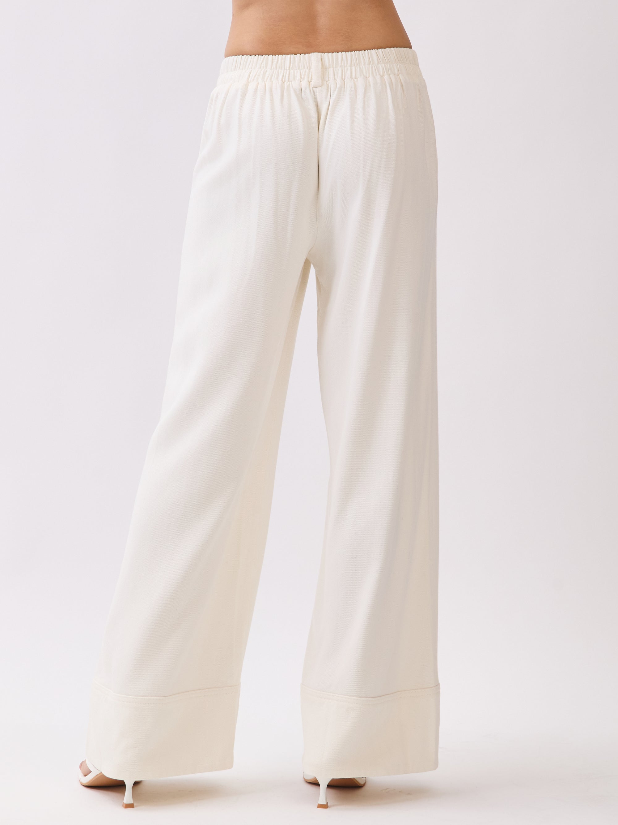Back view of BTTRMMT Ivory Sophia Pants showing the high-waist tailored fit, clean back panel, and wide-leg drape.