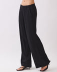 BTTRMMT Black Sophia Pants side view highlighting the wide-leg silhouette, smooth drape, and clean mid-rise waistband.